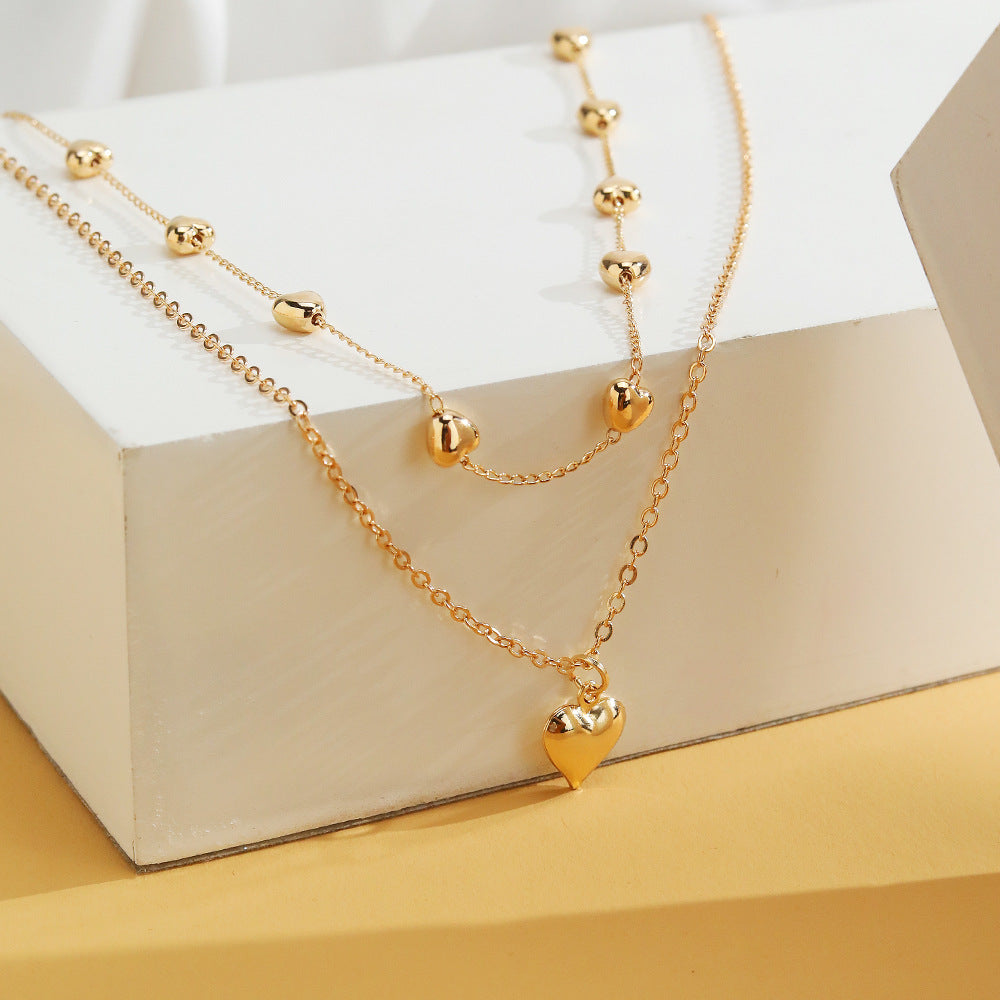 Colar Duas Camadas com Pingentes Coração Duo Heart Banhado a Ouro 18K
